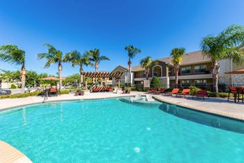 Pool With Sunning Deck at Pavilions at Northshore Apartment Homes, Portland, TX